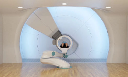 Циклотрон для протонной терапии с роботизированным координатным столом - SC360 - Provision Healthcare - со встроенным рентгеновским сканером / со встроенным TEP сканером