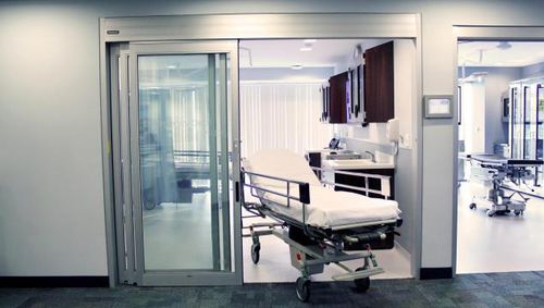 Дверь для интенсивной терапии - Dura-Care 7500A - Stanley Access Technologies - створчатая / возвратно-поступательное движение / автоматическая